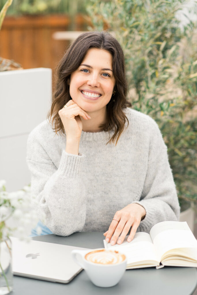 Flannery Functional Nutrition Dietitian at table with book